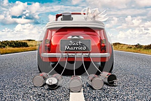 Just Married convertible on a road photo
