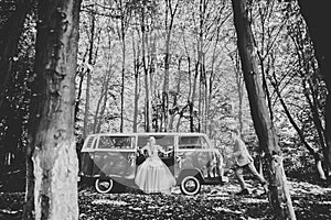 Just married couple in the luxury retro car on their wedding day