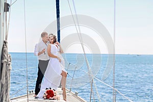 A Just married couple on yacht. Happy bride and groom on their wedding day