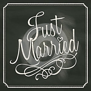 Just Married lettering sign on chalkboard background