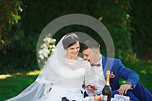 Just married loving hipster couple in wedding dress and suit in