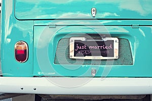 Just married sign on aquamarine classic vintage van