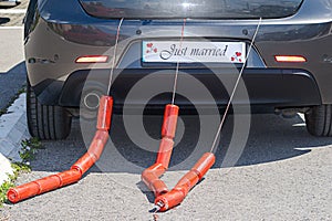 Just Married Sign Attached On Car`s Trunk