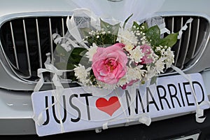 Just Married Sign Attached On Car`s Trunk photo