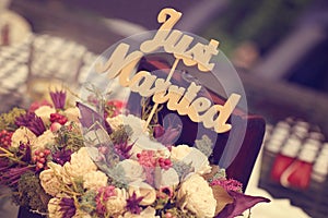 Just married sign in a flower bouquet