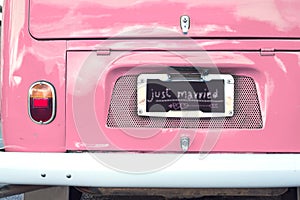 Just married sign on pink classic vintage van