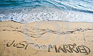 Just Married written in the Sand