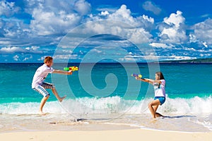 Just married young happy loving couple having fun on the tropical beach