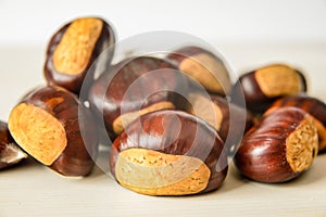 Just matured chestnuts on a white cutting board