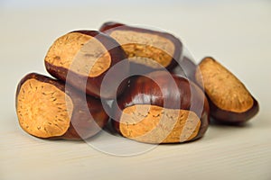 Just matured chestnuts on a white cutting board