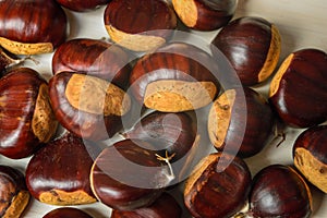 Just matured chestnuts on a white cutting board