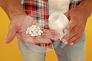 Just one pill can help. food additives for male health. bio vitamin complex. disease treatment. man drugs jar. man hold