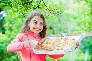 Just one slice. her favorite food. junk food concept. happy child hold big pizza. meal delivery in time. hungry kid