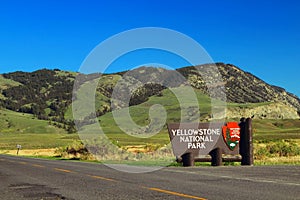 Yellowstone National Park Entrance Sign near the Roosevelt Arch at Gardiner, Montana, USA photo