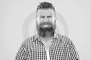 Just sneezed. Man bearded hipster with sneezing face closed eyes close up yellow background. Brutal hipster sneezing