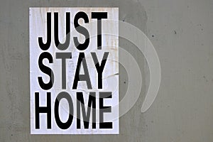 Just Stay Home sign on a concert wall