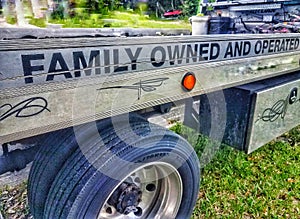 Family owned business  signage on a tow truck photo
