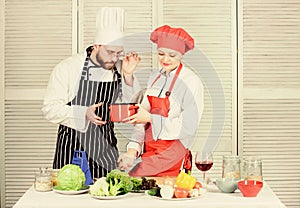 Just try this. Woman and bearded man cooking together. Try ingredients before cook. Estimate taste. Healthy food