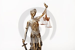 Justice blindfolded lady holding scales and sword statue