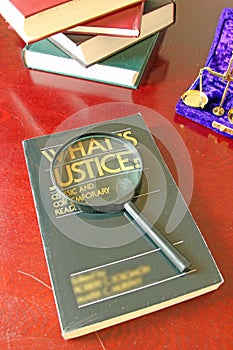 Justice Book And Magnifying Glass