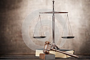 Justice Scales and books and wooden gavel on table