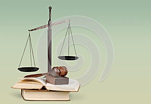 Justice Scales, gavel and books on light