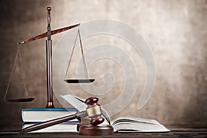 Justice Scales, gavel and books on light