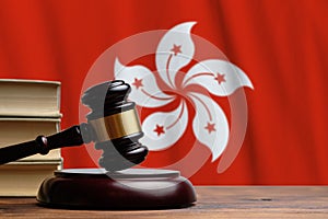 Justice and court concept in Hong Kong . Judge hammer on a flag background