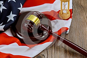 The Justice gavel lawyers office symbol legal law with hourglass on United States flag