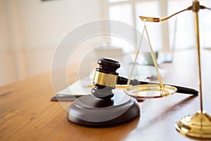 Justice law and books and wooden gavel tool on desk in Lawyer office.concept
