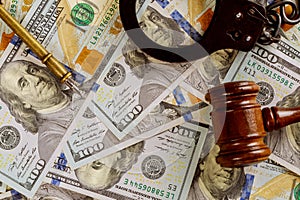 Justice and law concept cash dollars in banknotes judge gavel with handcuffs