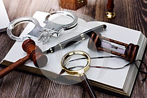 Justice and law concept.Male judge in a courtroom with the gavel, working with, computer and docking keyboard, eyeglasses, on