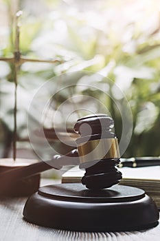 Justice and law concept.Male judge in a courtroom with the gavel, working with, computer and docking keyboard, eyeglasses, on