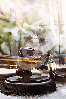 Justice and law concept.Male judge in a courtroom with the gavel, working with, computer and docking keyboard, eyeglasses, on