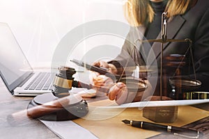 Justice and law concept.Male judge in a courtroom with the gavel, working with, computer and docking keyboard, eyeglasses, on