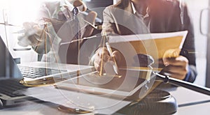 Justice and law concept.Male judge in a courtroom with the gavel, working with, computer and docking keyboard, eyeglasses, on