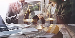 Justice and law concept.Male judge in a courtroom with the gavel, working with, computer and docking keyboard, eyeglasses, on