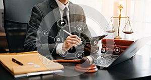 justice and law concept.Male judge in a courtroom the gavel, working with smart phone and laptop and digital tablet computer on