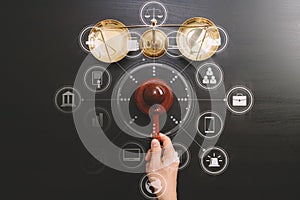 justice and law concept.Top view of Male judge hand in a courtroom with the gavel and brass scale on dark wood table with