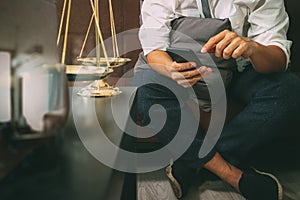 Justice and Law context.Male lawyer hand sitting on sofa and wor