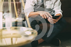 Justice and Law context.Male lawyer hand sitting on sofa and wor