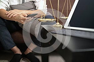 Justice and Law context.Male lawyer hand sitting on sofa and wor