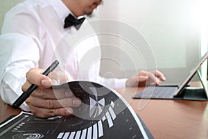 Justice and Law context.Male lawyer hand working with smart phone,digital tablet computer docking keyboard with gavel and