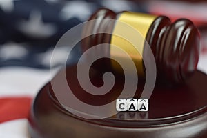 Justice mallet and CAA acronym. Cuban adjustment act