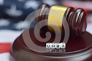 Justice mallet and UMRA acronym. Unfunded mandates reform act photo