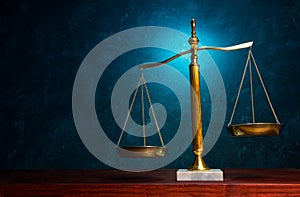Justice scale on blue background photo