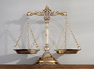 Justice Scale On Wooden Shelf Surface