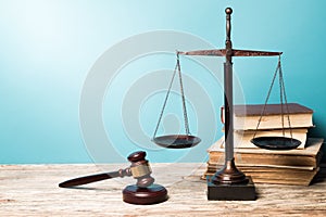 Justice Scales, books and gavel, close-up view