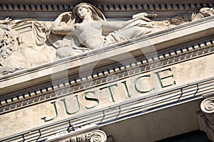 Justice sign on a Courtroom Building, close up