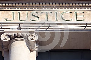 Justice sign on a Courtroom Building, law courts